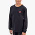A boy wearing a black long-sleeve Fox t-shirt with a red fox head logo and white graphic on sleeve, chest-down view.