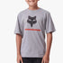 Fox Boys Optical Illusion Short Sleeve Tee in Tradewinds Grey, featuring a black Fox head logo and red stripe, worn by a