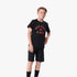 Young boy wearing a black Fox Boys Race short sleeve tee with a red &