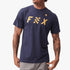 Fox Mens Checkered Short Sleeve Tee in Summit Navy, worn by a model with tattooed arms and grey pants, photographed