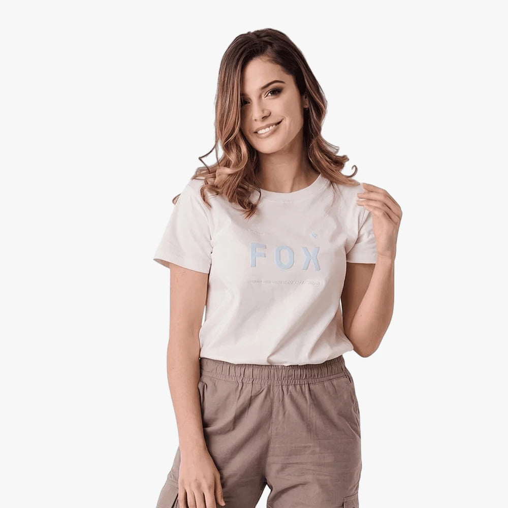 Smiling woman wearing a Fox Womens Aviation Short Sleeve T-shirt in Cloud Dancer white, paired with khaki cargo shorts.