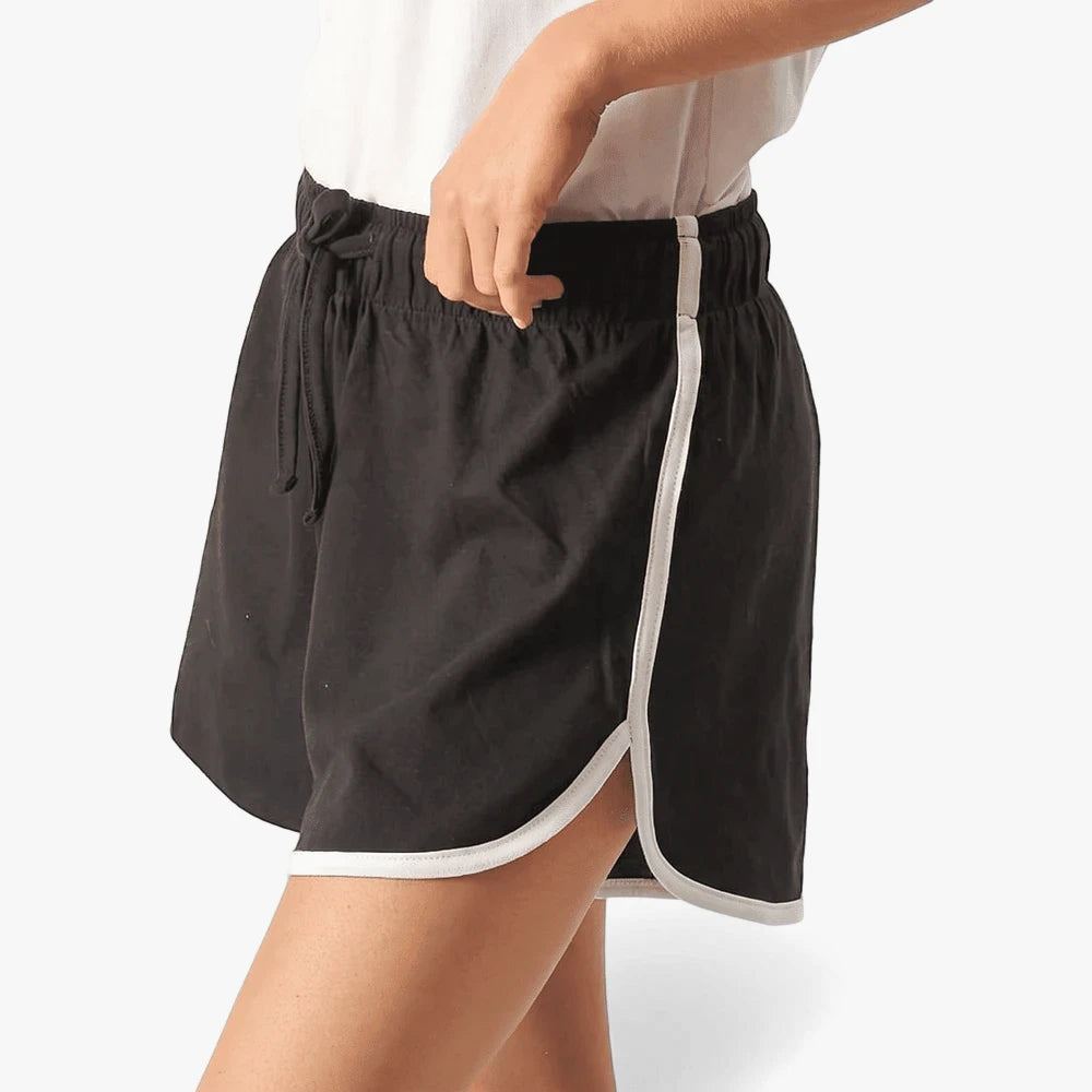 Fox Womens Bias Shorts in black with white piping, lightweight athletic shorts with curved hem and drawstring waist.