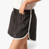 Fox Womens Bias Shorts in black with white piping, lightweight athletic shorts with curved hem and drawstring waist.