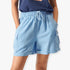 Fox Womens Flip Side Cargo Shorts in light blue, featuring an elastic waist, cargo pockets, and cuffed hems, worn by a woman.