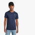 Male model wearing a navy G Star Basic Short Sleeve Tee, light wash jeans, and a black baseball cap.