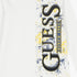Guess boys short sleeve tee in white featuring a vertical GUESS logo with blue and yellow paint splatter design.