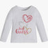 White Guess girls long sleeve tee featuring red, silver, and gold heart graphics with &