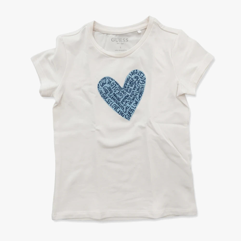 White Guess Girls short sleeve tee with a blue heart graphic filled with various words, laid flat on a surface.