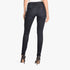 Back view of a model wearing dark blue-black Guess Tina Sexy Curvy Mid Rise Skinny Jeans with black high heels.