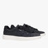 Pair of black Hey Dude Womens Karina Duo Classic Sneakers with white soles and black laces, presented in a studio setting.