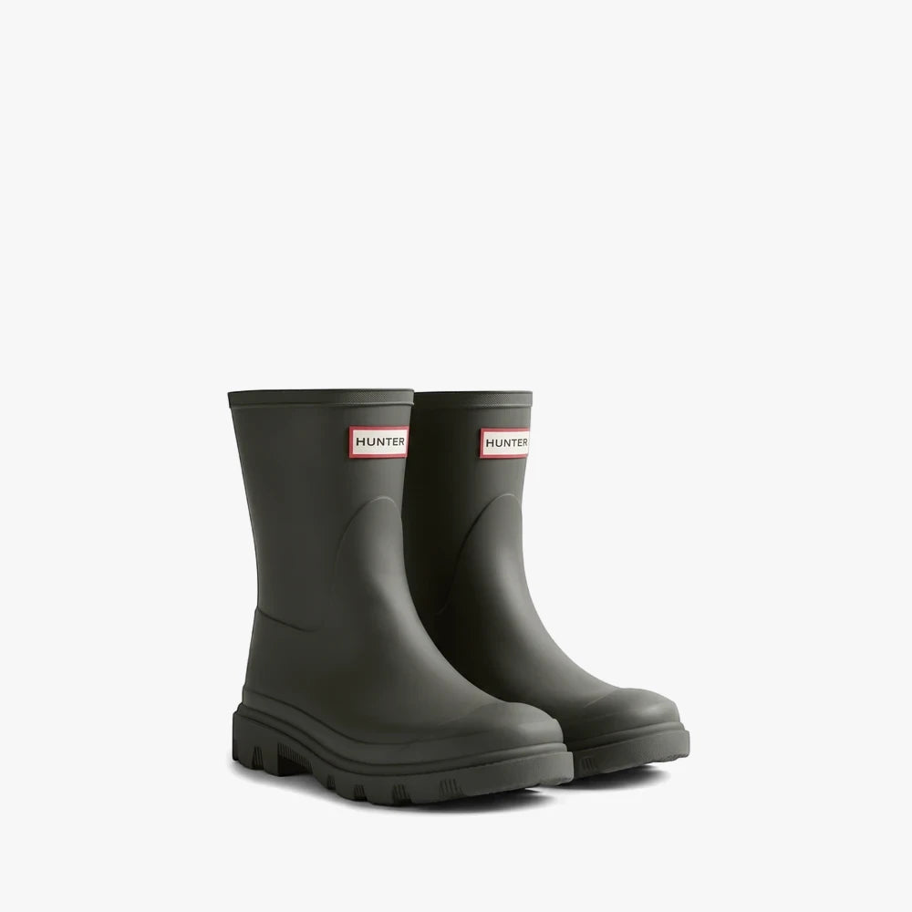 A pair of dark olive Hunter Womens Downpour Short Boots, waterproof mid-calf rain boots with chunky lug soles.