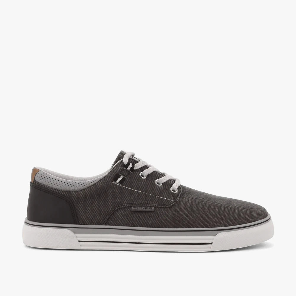 Hush Puppies Mens Jeromiah Washed Canvas Sneaker in black washed canvas with white laces and a white sole, viewed from the