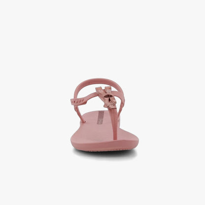 A single pink Ipanema Womens Class Charming Sandal with a delicate bow detail on the thong strap and an adjustable ankle