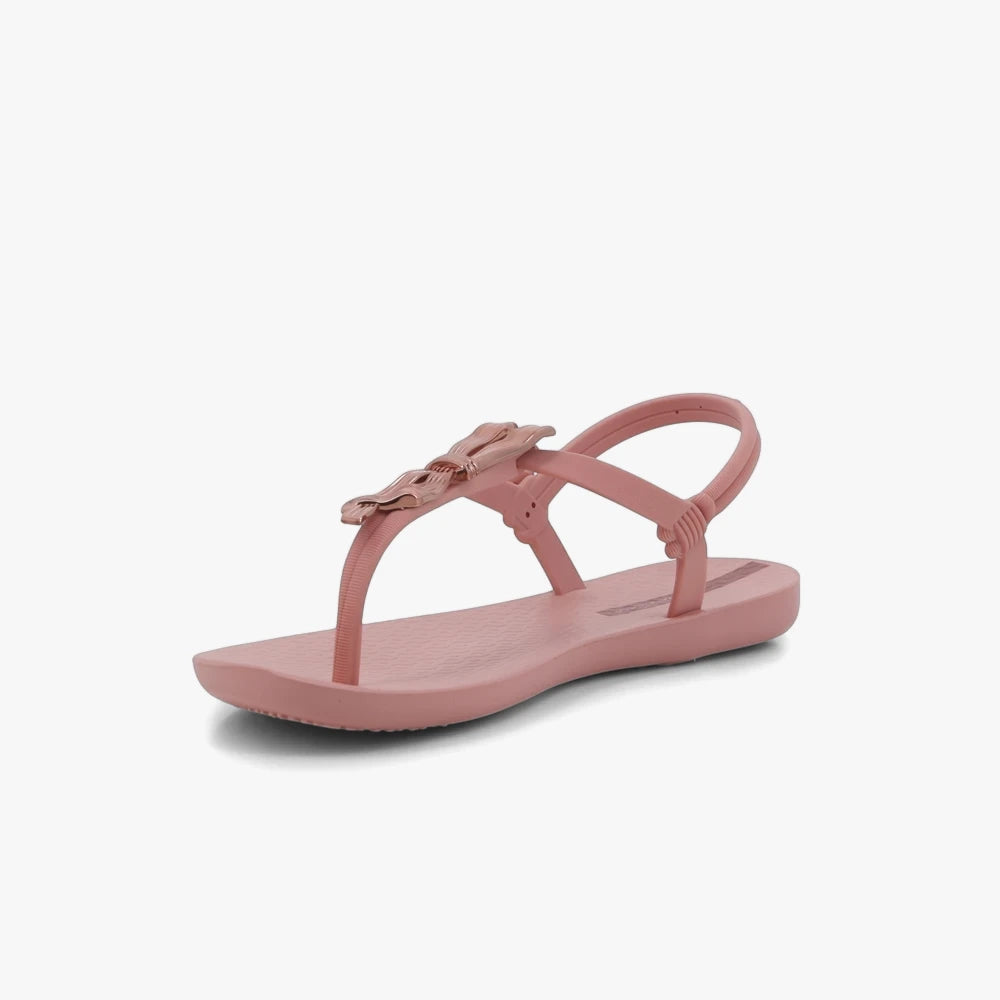 Pink Ipanema Womens Class Charming thong sandal with a decorative bow detail on the strap, shot from a side view.