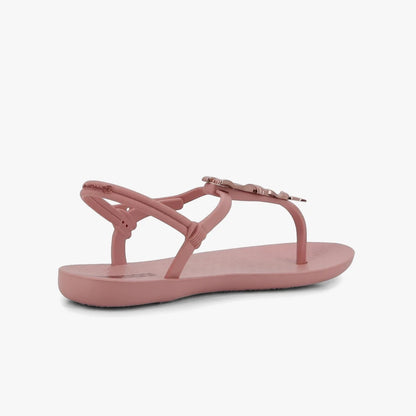 Pink Ipanema Womens Class Charming Sandal, shown from a side-rear view, featuring a thong strap with a decorative butterfly