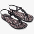 A pair of Ipanema Womens Class Conecta II sandals in black with pink floral patterned soles and decorative black beads on