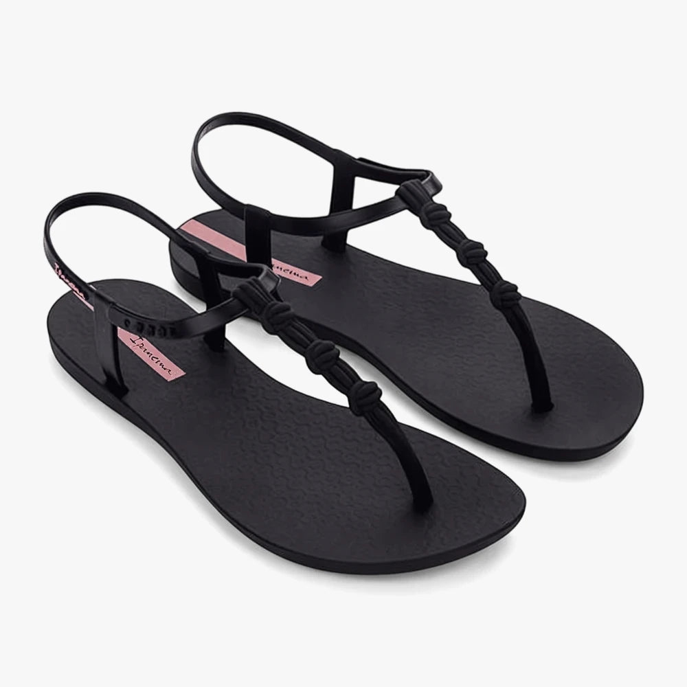 A pair of Ipanema Womens Class Link Sandals in black, featuring a T-strap design with elegant knotted details on the front