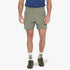 A man models olive green Jeep Mens 14Cm Fixed Wb Mountain Man Shorts Wavelite, visible from the upper chest down, paired