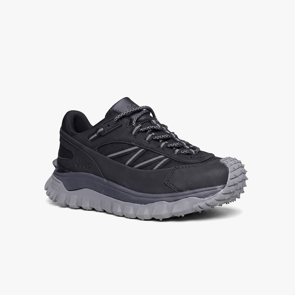 Black and grey Jeep Mens Cherokee Hiker Sneaker, shown from a side profile view, featuring a rugged sole.