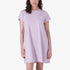 A woman models a short-sleeved, crew-neck Jeep City Lite Dress in digital lavender, featuring a small white logo.