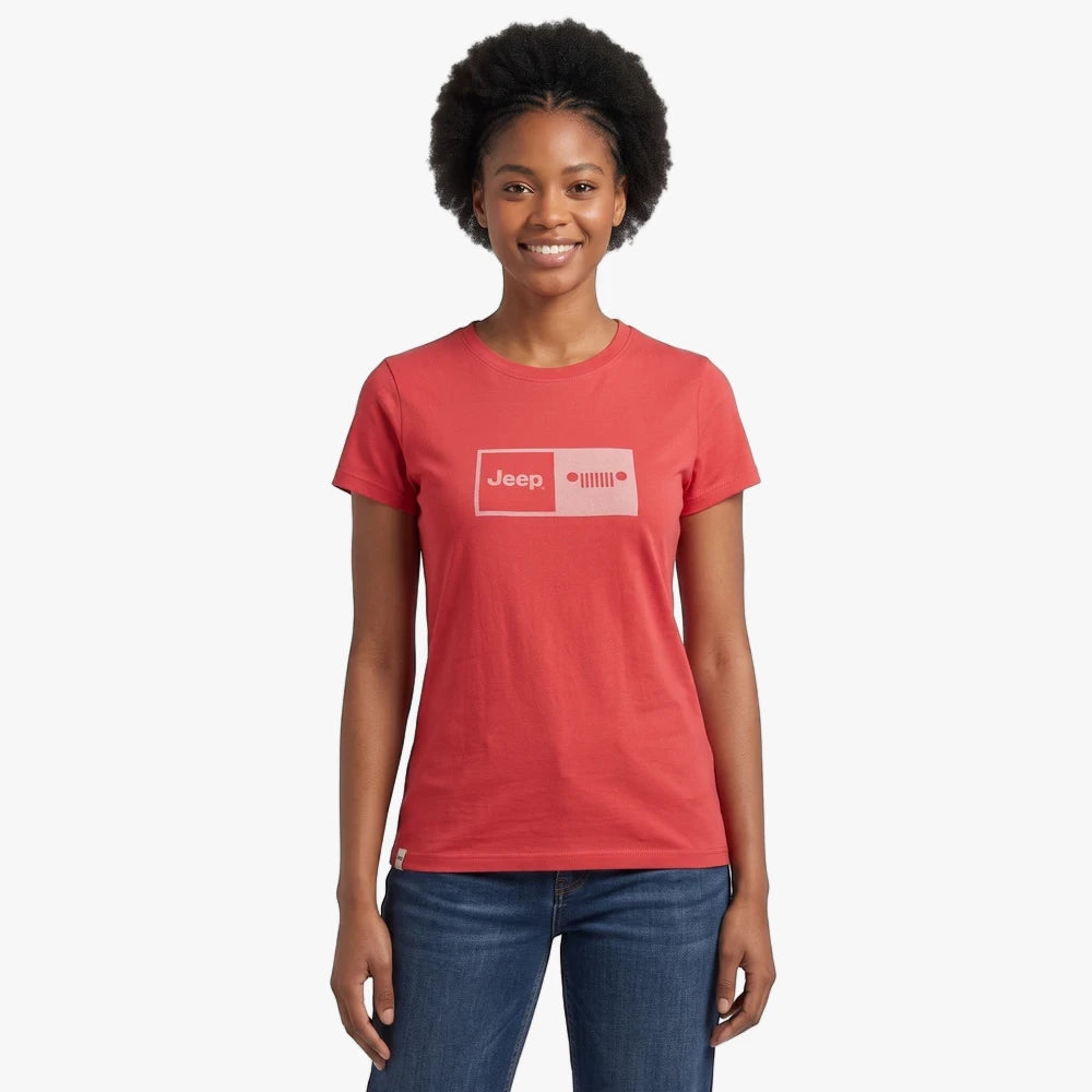 A smiling woman models a red Jeep Womens Foil Grill Short Sleeve Tee in Astro Dust, featuring a light pink logo on the front.