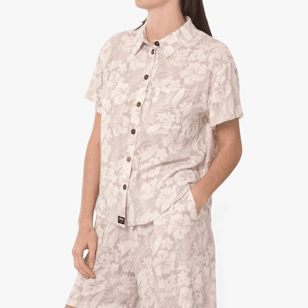 Jeep Womens Resort Printed Shirt Multi: short-sleeve button-up with tropical floral pattern, worn by a woman with matching