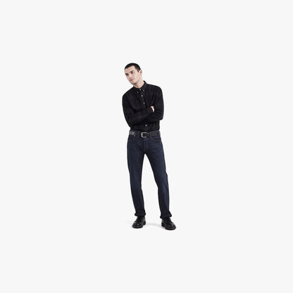 Levis Mens 501 Original Cut Night Hours jeans worn by a male model in a black button-down shirt and black shoes.