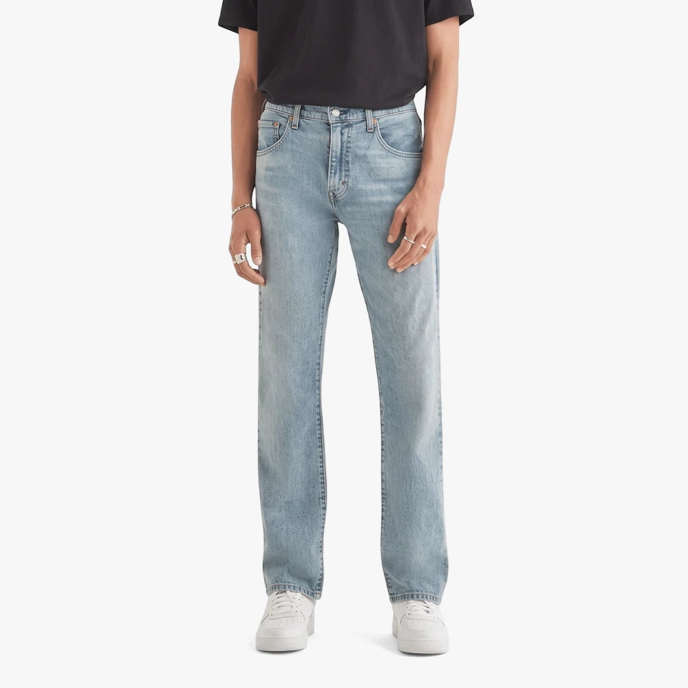 Levis Mens 517 Bootleg Jeans in Its All Fun Stonewash. Light blue denim jeans worn by a male model.