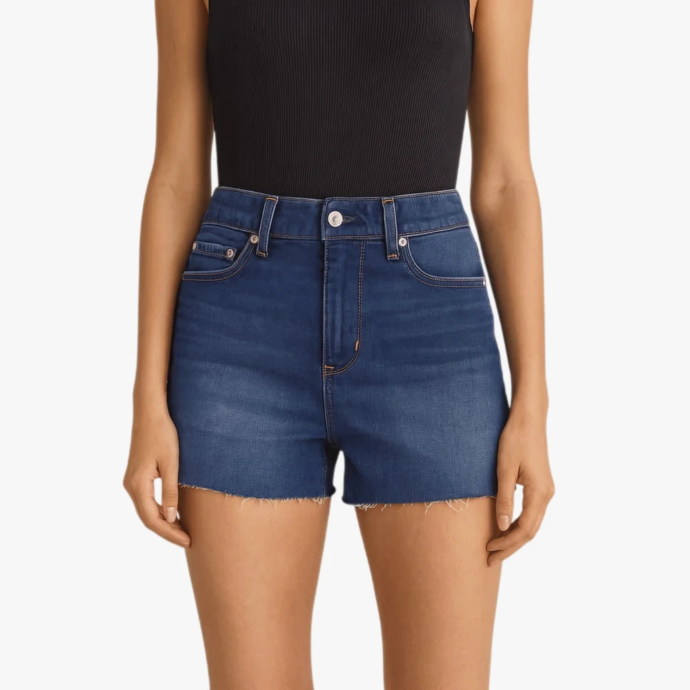 Levis Womens High Rise Za Second Go Shorts in blue denim with a raw hem, worn by a woman.