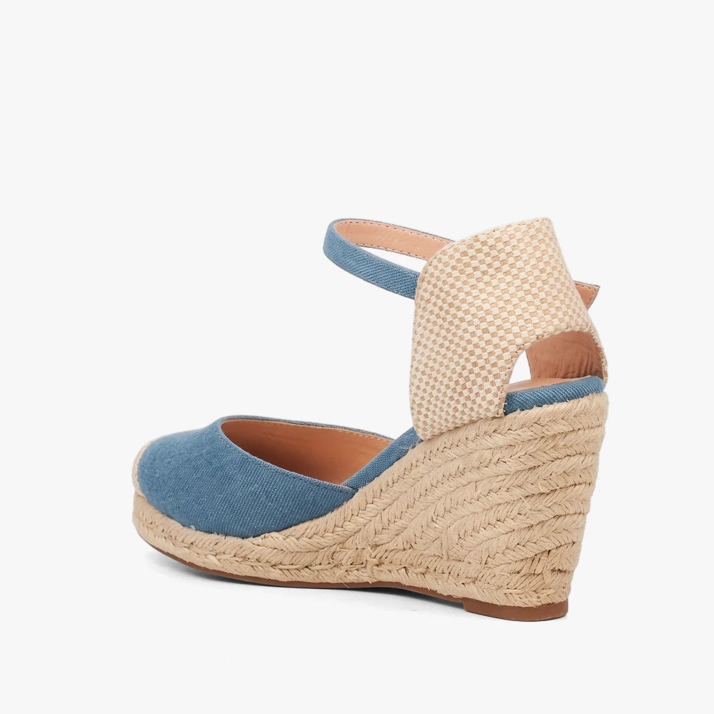Miss Black Womens Jojo 12 blue denim espadrille wedge sandals with an ankle strap, shown from the side.