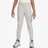 Nike Boys City Utility Cargo Pants in light grey, featuring cargo pockets, an elastic waistband, and tapered fit, shown on a