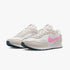 A pair of Nike Girls Md Valiant sneakers in grey and pink, presented from a side view.