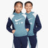 Two children wearing blue, navy, and white Nike Kids Air Cb Hoodies and matching shorts, posed in a studio.