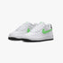 Two white Nike Kids Air Force 1 sneakers with bright green swooshes and black outsoles, displayed from a side-front view.