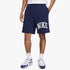 Nike Mens French Terry Shorts in navy blue with a white logo, worn by a model along with white socks and blue and white