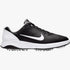 Black and white Nike Mens Infinity Golf Sneaker, side profile view, featuring a prominent white swoosh and a spiked sole for