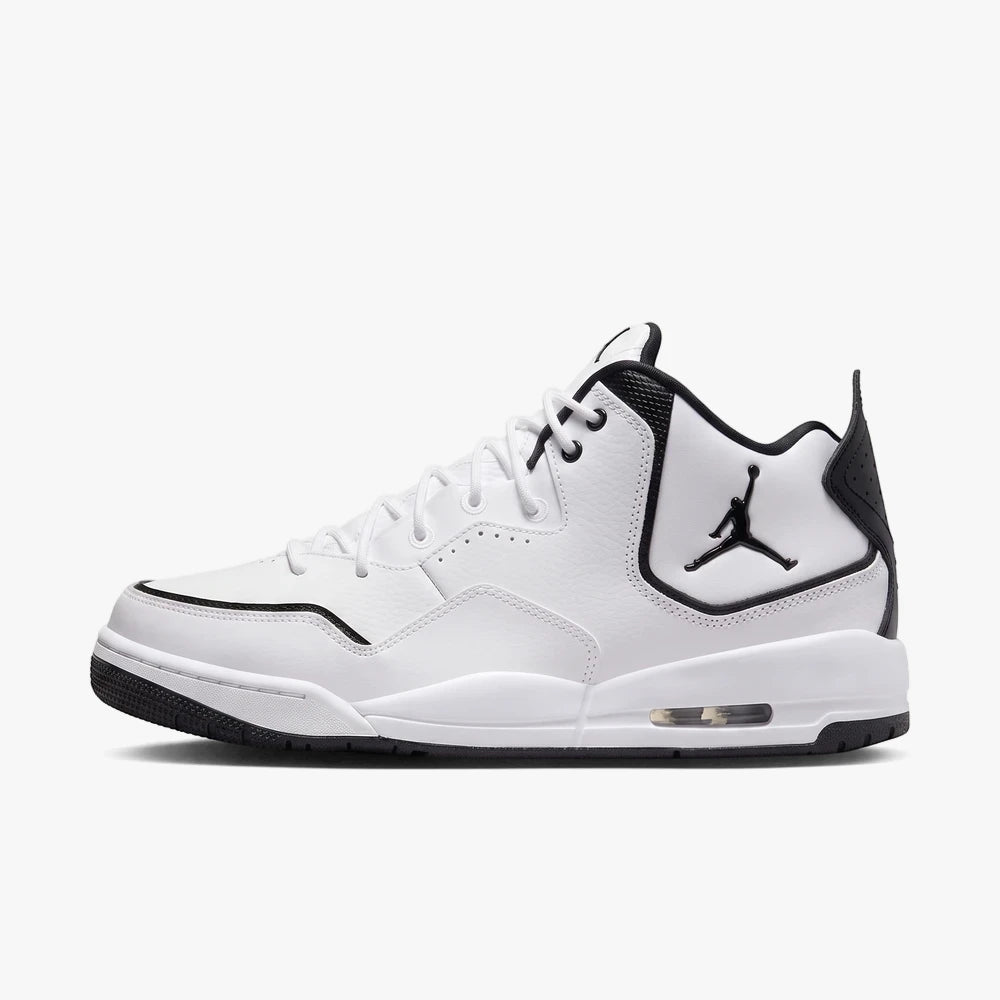 Nike Mens Jordan Courtside 23 Sneaker in white and black, shown from a side view. A stylish athletic shoe.