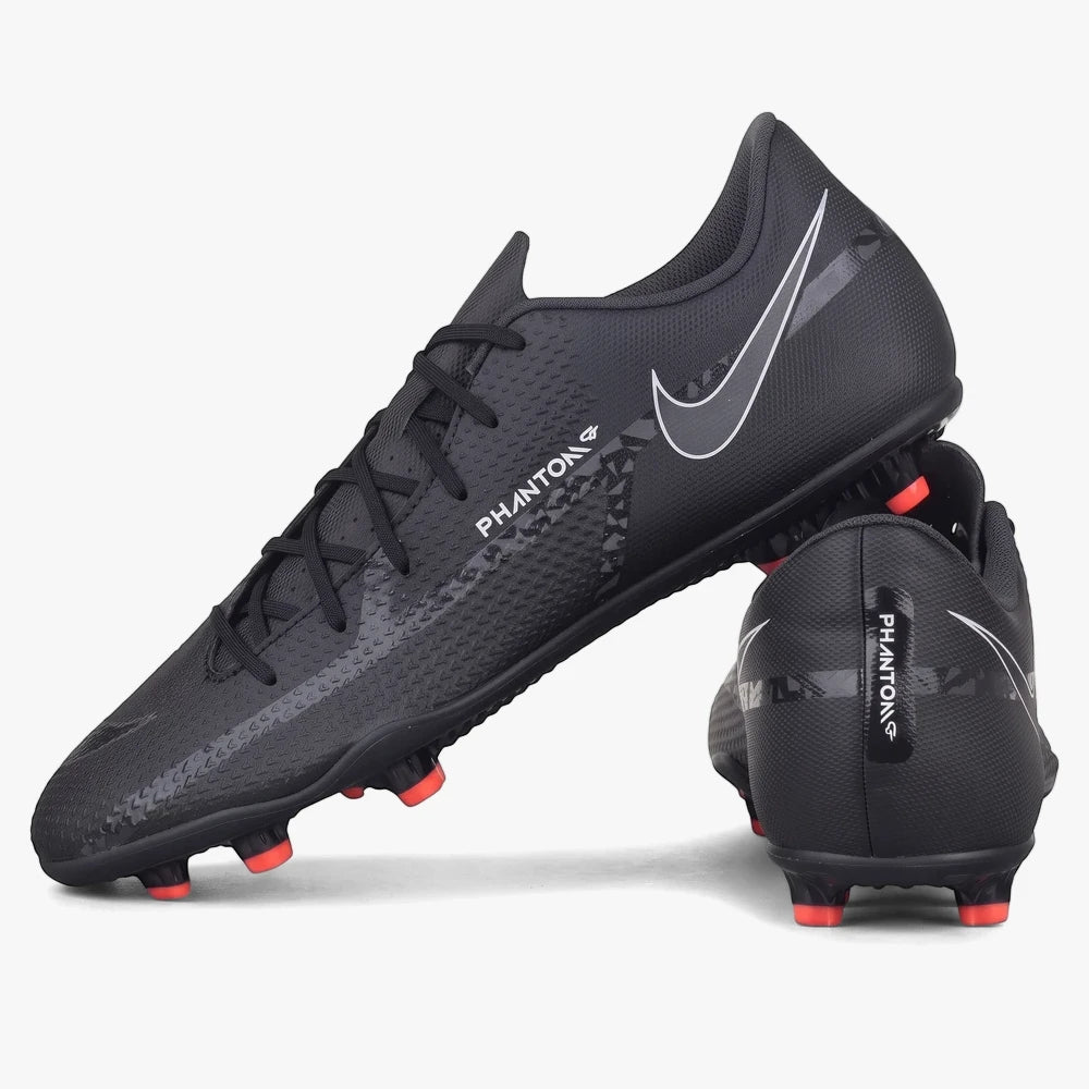 Black Nike Mens Phantom GT2 Club FG/MG soccer boots with white swoosh and orange studs, shown from a side angle.