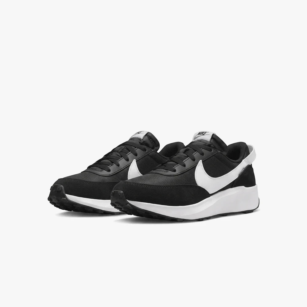 Nike Mens Waffle Debut Sneakers in black and white with a prominent white swoosh, showcased in a clean side profile.