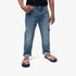 Polo Boys Tom Slim Fit Jean in light wash blue denim, shown on a child wearing navy and white flip-flops.