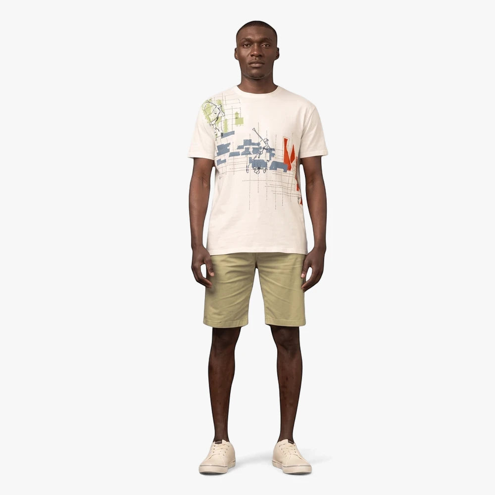 Man wearing an off-white Polo short sleeve tee with a distorted print, paired with khaki shorts and white sneakers.