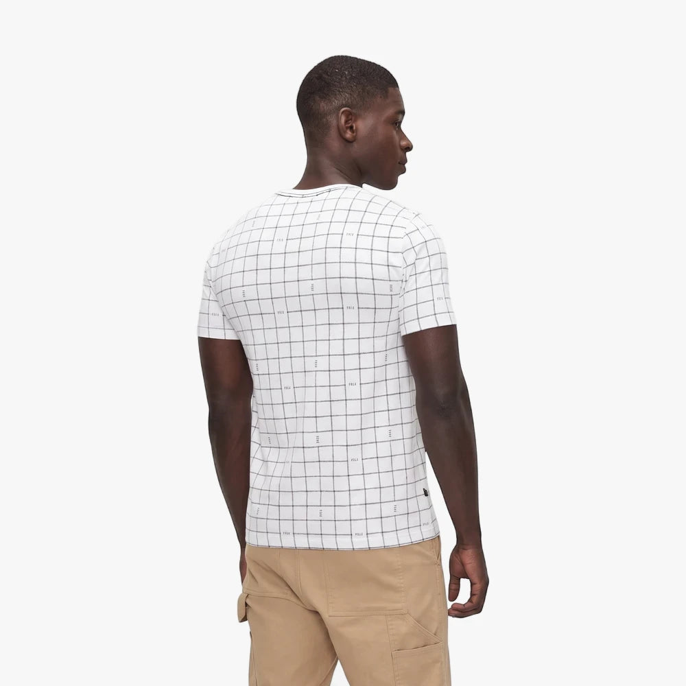 Polo Mens Printed Grid Short Sleeve Tee in white, worn by a dark-skinned model from a back-right view, paired with khaki