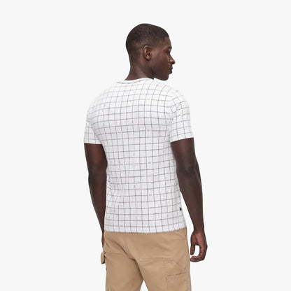 Polo Mens Printed Grid Short Sleeve Tee in white, worn by a dark-skinned model from a back-right view, paired with khaki