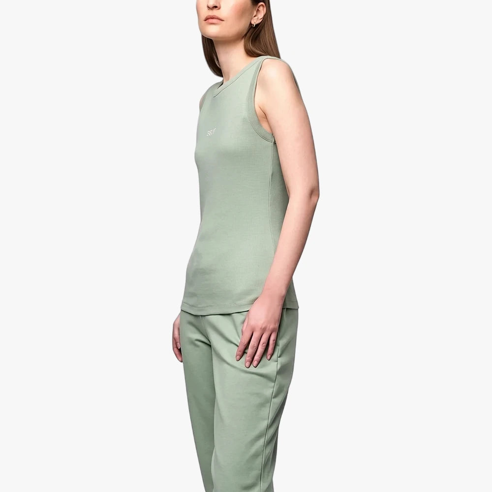 Polo Womens Thandiwe Tank Top Sage, a sleeveless sage green top, worn by a female model with matching sweatpants, shown from