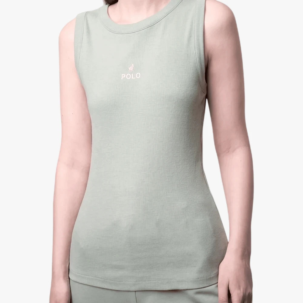 Close-up of a woman wearing a sage green ribbed Polo Thandiwe sleeveless tank top with a small pink embroidered logo.