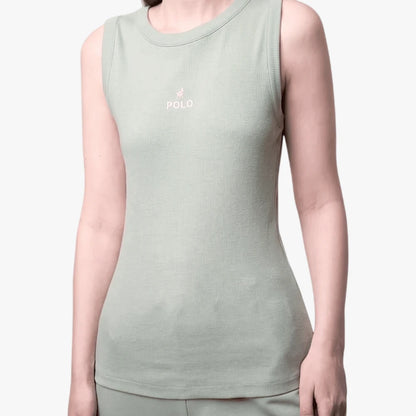 Close-up of a woman wearing a sage green ribbed Polo Thandiwe sleeveless tank top with a small pink embroidered logo.