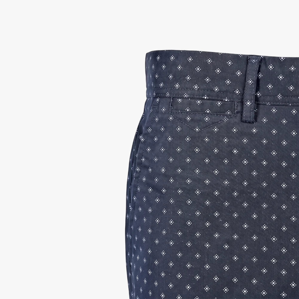 Close-up of Pringle Mens Peter Printed Shorts in navy featuring a subtle white geometric pattern, showcasing the waistband