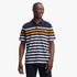 Pringle Mens Victor Mercerised Short Sleeve Golfer Navy polo shirt with white and orange stripes, worn by a smiling man.