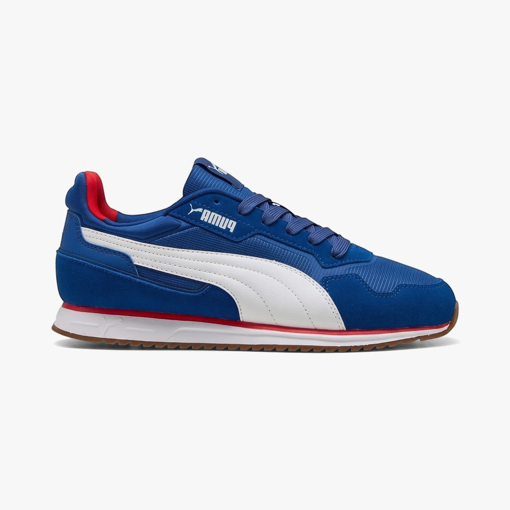 Puma Boys Softride St Miller sneaker in blue with white Formstrip, red accents, white laces, and gum outsole, side view.