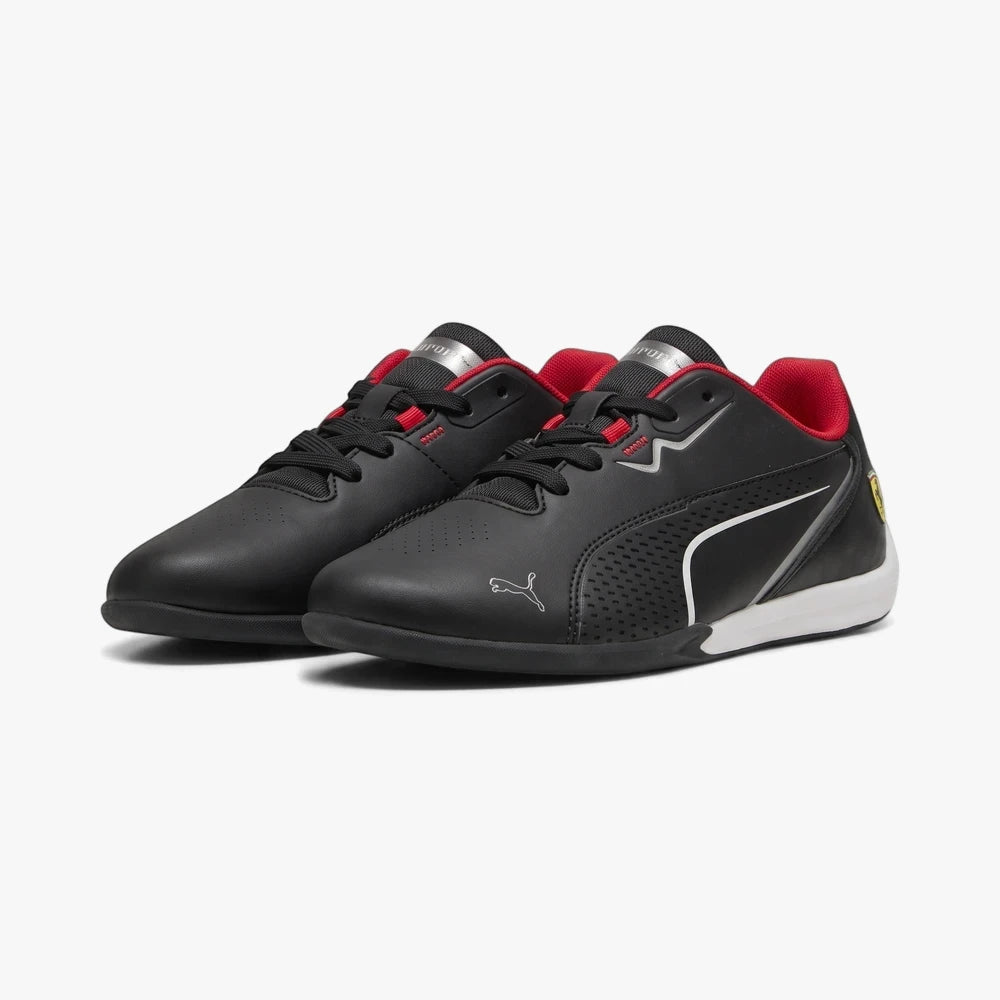 Black Puma Drift Cat 11 Jnr sneakers with red lining and white accents, showcasing a sleek design and brand logos.